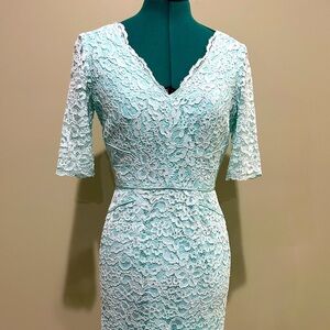 Lace, fitted light teal dress